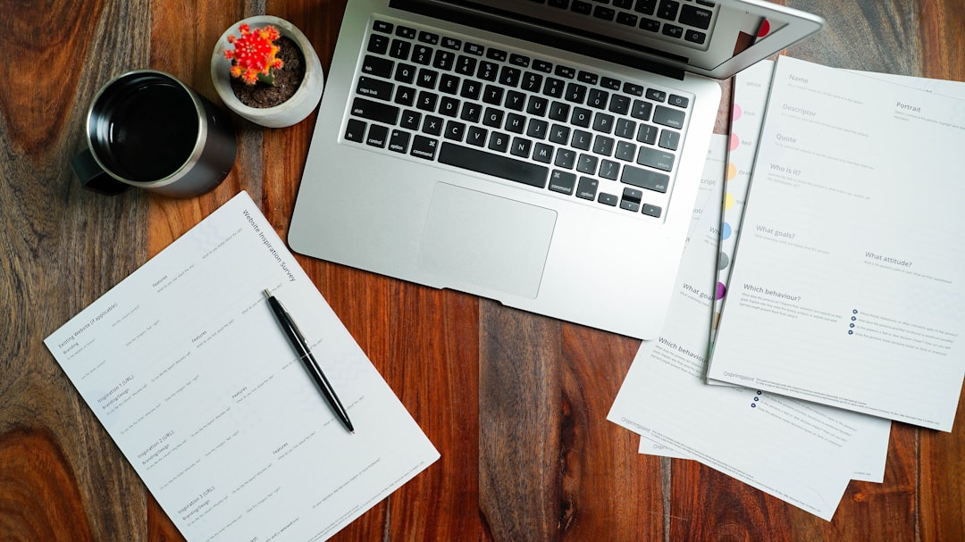 Mortgage paperwork and a calculator spread across a desk